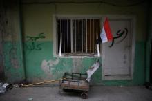 A flag of Iraq is seen outside a house on a street controlled by Iraqi Federal Police in western Mosul, Iraq, April 12, 2017. PHOTO BY REUTERS/Andres Martinez Casares