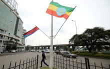 A police officer walks past the flags of Ethiopia and Eritrea ahead of Eritrea's President Isaias Afwerki's visit to Addis Ababa, Ethiopia, July 13, 2018. PHOTO BY REUTERS/Tiksa Negeri