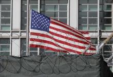 A flag flies behind an enclosure on the territory of the U.S. embassy in Moscow, Russia, March 28, 2018. PHOTO BY REUTERS/Tatyana Makeyeva