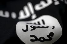 An Islamic State flag is seen in this picture illustration, February 18, 2016. PHOTO BY REUTERS/Dado Ruvic