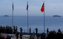 Australian, New Zealand and Turkish soldiers attend a dawn ceremony marking the 100th anniversary of the Battle of Gallipoli, at Anzac Cove in Gallipoli, April 25, 2015. PHOTO BY REUTERS/Osman Orsal