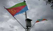 Ethiopian and Eritrean flags flutter during the welcoming ceremony of Eritrean Foreign Minister Osman Saleh and his delegation at the Bole International Airport in Addis Ababa, Ethiopia, June 26, 2018. PHOTO BY REUTERS/Tiksa Negeri