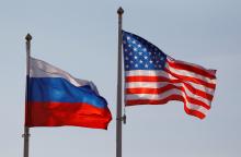 National flags of Russia and the U.S. fly at Vnukovo International Airport in Moscow, Russia, April 11, 2017. PHOTO BY REUTERS/Maxim Shemetov