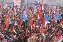 People hold up the flag of former South Yemen during a rally commemorating the 53nd anniversary of the start of South Yemen's uprising against British rule, in the southern port city of Aden, Yemen, October 14, 2016. PHOTO BY REUTERS/Fawaz Salman