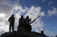 Members of East Libyan forces stand atop a vehicle in Ganfouda district in Benghazi, Libya January 26, 2017. REUTERS/Esam Omran Al-Fetori