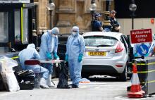 Forensic investigators work at the site after a car crashed outside the Houses of Parliament in Westminster, London, Britain, August 14, 2018. PHOTO BY REUTERS/Henry Nicholls