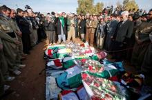 Mourners pray during a funeral of victims who were killed in a bomb attack at the offices of the Democratic Party of Iranian Kurdistan (PDKI) in Koy Sanjak, east of Erbil, Iraq, December 21, 2016. REUTERS/Azad Lashkari