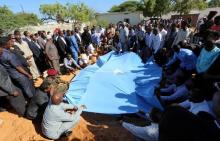 Relatives and government officials bury the dead body of Somalia's public works minister Abbas Abdullahi Sheikh Siraji who was shot and killed in the capital Mogadishu, Somalia, May 4, 2017. PHOTO BY REUTERS/Feisal Omar