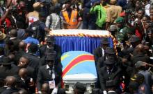 Mourners escorting the casket of legendary Congolese singer Papa Wemba, born Jules Shungu Wembadio Pene Kikumba, from the the Notre Dame du Congo Cathedral for burial, along the streets of the Democratic Republic of Congo's capital Kinshasa, May 4, 2016. PHOTO BY REUTERS/Jean Robert