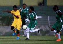 Players of Al-tahadi (green kits) and Al-Difaa (yellow kits) woman soccer teams fight for the ball during Sudan's first women's league soccer match at the Khartoum stadium, Khartoum, Sudan, September 30, 2019. PHOTO BY REUTERS/Mohamed Nureldin Abdallah