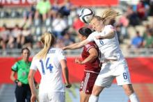 England defender Laura Bassett (6) heads the ball against Mexico forward Charlyn Corral (9) during the second half in a Group F soccer match in the 2015 FIFA women's World Cup at Moncton Stadium, Moncton, New Brunswick, CAN, June 13, 2015. PHOTO BY USA TODAY Sports/Matt Kryger