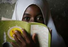 A girl attends a Koranic school in the village of Bwejuu on Zanzibar island, Tanzania, December 2, 2007. PHOTO BY REUTERS/Finbarr O'Reilly