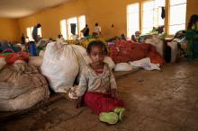 A girl sits next to her family's belongings inside a shelter within a camp for the internally displaced people in Chelelektu, a town in the Southern Nations, Nationalities, and Peoples' Region in Ethiopia, August 15, 2018. PHOTO BY REUTERS/Tiksa Negeri