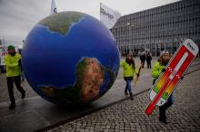 Protesters demonstrate during a rally held the day before the start of the Paris Climate Change Summit in Berlin, Germany, November 29, 2015. PHOTO BY REUTERS/Pawel Kopczynski