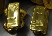 Gold bars are stacked in the safe deposit boxes room of the Pro Aurum gold house in Munich, March 3, 2014. PHOTO BY REUTERS/Michael Dalder