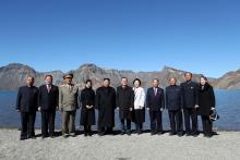 South Korean President Moon Jae-in, first lady Kim Jung-sook, North Korean leader Kim Jong Un and his wife Ri Sol Ju pose for photographs with North Korean aides beside the Heaven Lake of Mt. Paektu, North Korea, September 20, 2018. PHOTO BY REUTERS/Pyeongyang Press Corps