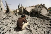 A guard sits on the rubble of the house of Brigadier Fouad al-Emad, an army commander loyal to the Houthis, after air strikes destroyed it in Sanaa, Yemen, June 15, 2015. PHOTO BY REUTERS/Khaled Abdullah