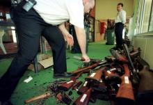 Guns that have just had their barrels crushed in Sydney are stacked after they were handed over on the last day of the Australian gun buy-back scheme. PHOTO BY REUTERS