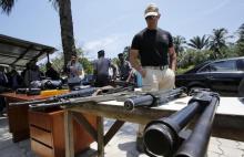 A French security guard looks at arms at Agban gendarmerie camp during French Interior Minister Bernard Cazeneuve and French Foreign Minister Jean-Marc Ayrault visit, in Abidjan, Ivory Coast, March 15, 2016. PHOTO BY REUTERS/Thierry Gouegnon