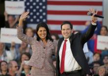 South Carolina Governor Nikki Haley (L) and U.S. Republican presidential candidate Marco Rubio react on stage during a campaign event in Chapin, South Carolina, February 17, 2016. PHOTO BY REUTERS/Chris Keane