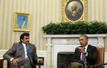 U.S. President Barack Obama meets with Emir of Qatar Sheikh Tamim bin Hamad al Thani while in the Oval Office at the White House in Washington, February 24, 2015. PHOTO BY REUTERS/Larry Downing
