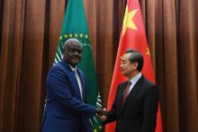 African Union Commission Chairperson Moussa Faki Mahamat (L) shakes hands with Chinese Foreign Minister Wang Yi before a meeting in Beijing, China, February 8, 2018. PHOTO BY REUTERS/Greg Baker