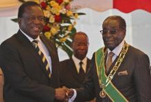 President Robert Mugabe (R) greets Vice President Emmerson Mnangagwa as he arrives for Zimbabwe's Heroes Day commemorations in Harare, August 10, 2015. PHOTO BY REUTERS/Philimon Bulawayo
