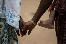 Nigerian refugee Fati, walks with her mother, Mariam, while carrying her sister at the Minawao refugee camp in Northern Cameroon. PHOTO BY REUTERS/Karel Prinsloo/UNICEF