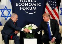 U.S. President Donald Trump shakes hands with Israeli Prime Minister Benjamin Netanyahu during the World Economic Forum (WEF) annual meeting in Davos, Switzerland, January 25, 2018. PHOTO BY  REUTERS/Carlos Barria