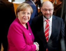 Leader of the Christian Democratic Union (CDU) and the acting German Chancellor Angela Merkel and Social Democratic Party (SPD) leader Martin Schulz shakes hands before exploratory talks about forming a new coalition government at the SPD headquarters in Berlin, Germany, January 7, 2018. PHOTO BY REUTERS/Hannibal Hanschke