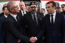 French President Emmanuel Macron shakes hands with Mohamed Rabie Khlie, general director of Office National des Chemins de Fer (ONCF), next to Moroccan King Mohammed VI, after the inauguration of a high-speed line at Rabat train station, in Rabat, France, November 15, 2018. PHOTO BY REUTERS/Christophe Archambault