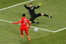 England's Jesse Lingard in action with Tunisia's Mouez Hassen. PHOTO BY REUTERS/Gleb Garanich