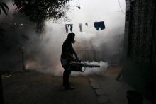 A health worker fumigates the Altos del Cerro neighbourhood as part of preventive measures against the Zika virus and other mosquito-borne diseases in Soyapango, El Salvador, January 21, 2016. PHOTO BY REUTERS/Jose Cabezas