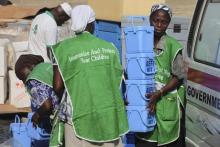 Local health workers carry vaccination kits at a distribution centre ahead of the start of a nationwide polio immunization campaign on Wednesday, in Lagos, February 21, 2011. PHOTO BY REUTERS/Akintunde Akinleye