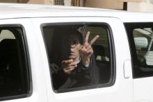 The man who was arrested after he hijacked an EgyptAir flight, which was forced to land in Cyprus on Tuesday, gestures as he is transferred by Cypriot police from a court in the city of Larnaca, Cyprus, March 30, 2016. PHOTO BY REUTERS/Yiannis Kourtoglou