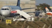 Two hijackers of a Libyan Afriqiyah Airways Airbus A320 surrender to Maltese military on the runway at Malta Airport, December 23, 2016. PHOTO BY REUTERS/Darrin Zammit-Lupi