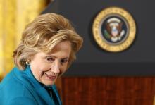 Former first lady Hillary Clinton sits down before the Presidential Medal of Freedom ceremony in the East Room of the White House in Washington