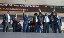 South Sudan's President Salva Kiir holds hands with South Sudanese rebel leader Riek Machar as Sudan's President Omar al-Bashir and Kenya's President Uhuru Kenyatta witness before the signing a ceasefire and power sharing agreement in Khartoum, Sudan, August 5, 2018. PHOTO BY REUTERSKenya Presidential Press Service