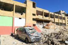 Damaged ambulance and hospital are at a site hit by overnight airstrike, in Kafr Takharim, northwest of Idlib city, Syria, April 25, 2017. PHOTO BY REUTERS/Ammar Abdullah