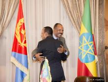 Ethiopia's Prime Minister Abiy Ahmed and Eritrean President Isaias Afwerki embrace at the declaration signing in Asmara, Eritrea July 9, 2018 in this photo obtained from social media on July 10, 2018. PHOTO BY REUTERS/GHIDEON MUSA ARON VISAFRIC