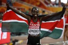 Hyvin Kiyeng Jepkemoi of Kenya celebrates winning the women's 3,000 metres steeplechase final during the 15th IAAF World Championships at the National Stadium in Beijing, China, August 26, 2015. PHOTO BY REUTERS/Phil Noble