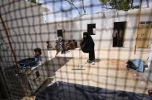 Tunisian Iman Othman, wife of a former Islamic State fighter, cleans the floor at a camp for displaced people in Ain Issa, north of Raqqa, Syria, June 21, 2017. PHOTO BY REUTERS/Rodi Said