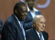 Issa Hayatou (L), Senior Vice President of the FIFA stands with FIFA President Sepp Blatter after he was re-elected at the 65th FIFA Congress in Zurich, Switzerland, May 29, 2015. PHOTO BY REUTERS/Arnd Wiegmann