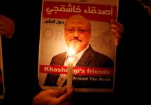 A demonstrator holds a poster with a picture of Saudi journalist Jamal Khashoggi outside the Saudi Arabia consulate in Istanbul, Turkey, October 25, 2018. PHOTO BY REUTERS/Osman Orsal