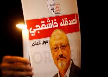 A demonstrator holds a poster with a picture of Saudi journalist Jamal Khashoggi outside the Saudi Arabia consulate in Istanbul, Turkey, October 25, 2018. PHOTO BY REUTERS/Osman Orsal