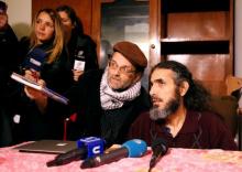 Former Guantanamo detainee Jihad Diyab (R) from Syria answers media questions during a news conference, while on a hunger strike, in Montevideo, Uruguay, September 30, 2016. PHOTO BY REUTERS/Andres Stapff