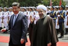 Iranian President Hassan Rouhani (R) and Chinese President Xi Jinping greet children during the welcome ceremony at the Xijiao State Guesthouse in Shanghai, May 22, 2014. PHOTO BY REUTERS/Kenzaburo Fukuhara