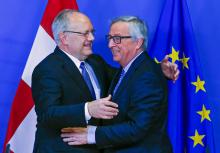 Swiss President Johann Schneider-Ammann (L) is welcomed by European Commission President Jean-Claude Juncker ahead of a meeting at the European Commission headquarters in Brussels, Belgium, January 15, 2016. PHOTO BY REUTERS/Yves Herman