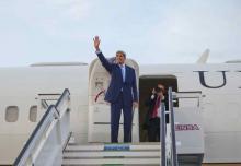 U.S. Secretary of State John Kerry waves from the top of the stairs before boarding his aircraft for his departure at Jose Marti International Airport in Havana, Cuba, August 14, 2015. PHOTO BY REUTERS/Pablo Martinez Monsivais