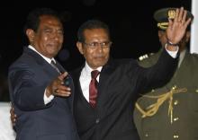 Newly appointed East Timor President Jose Maria de Vasconcelos, known as Taur Matan Ruak (R) waves his hand as he is greeted by Parliament Chief Fernando Lasama de Araujo after the inauguration ceremony Dili, May 20, 2012. PHOTO BY REUTERS/Lirio Da Fonseca